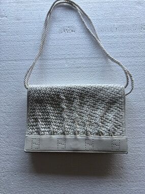 Vintage Fendi flap bag with braided cord shoulder strap. White worn with dustbag